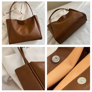 Détails du grand sac cabas marron montrant le fermoir magnétique et la doublure orange