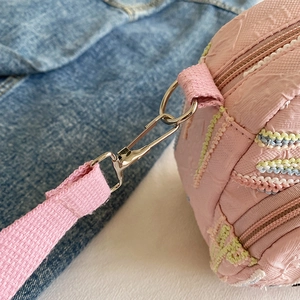 Pink textured canvas crossbody phone bag for women with silver metal hook and color stitching