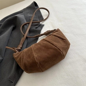 Brown frosted matte hobo dumpling bag with ruched design and slim shoulder strap