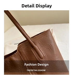Macro shot of brown faux leather shoulder strap with reinforced double stitching detail