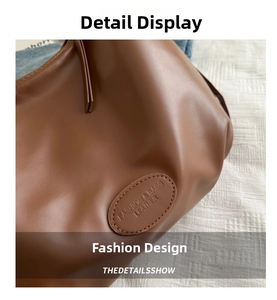 Close-up of brown PU leather bag with embossed fashion label and soft texture detail