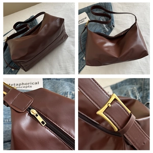 Detail view of deep brown faux leather tote with adjustable strap and matte hardware