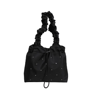 Black nylon tote bag with silver studs and pleated cloud handle in 45-degree view