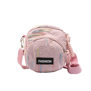 Pink canvas crossbody phone bag with quilted texture and colorful embroidery