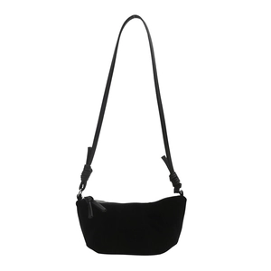 Minimalist black crescent hobo bag with knotted shoulder straps and smooth suede texture