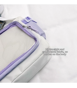 Detailed close-up of the white mesh pocket and purple zipper on the stylish crossbody bag