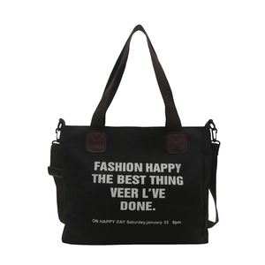 Retro canvas tote bag in black with brown straps and spacious interior for daily use