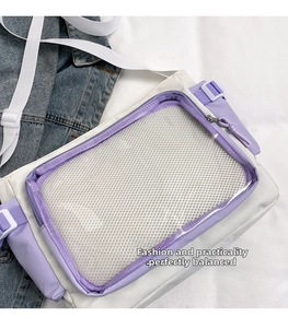 Detail of white and purple PVC patchwork crossbody bag with transparent mesh pocket