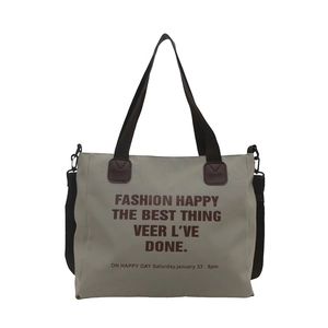 Sac fourre-tout en toile grise avec imprimé lettres et anses marrons sur fond blanc