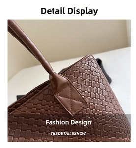 Detailed macro view of deep brown woven leather strap and reinforced cross-stitching