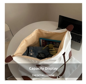 Large capacity tote bag showing interior space with tablet, umbrella and daily essentials