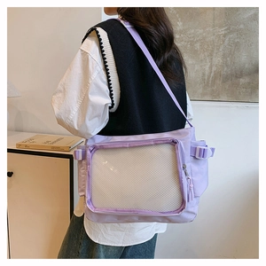 Detail of light purple canvas crossbody bag with transparent front mesh pocket and strap buckle