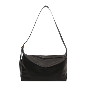 Minimalist black nylon tote bag with adjustable shoulder strap and zipper closure