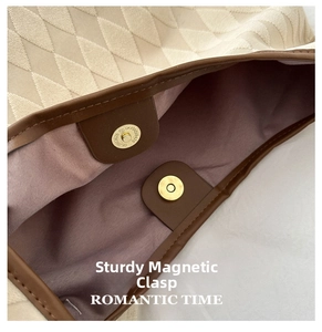 Detail of magnetic snap closure and purple lining on quilted tote bag for women
