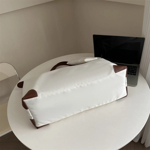 Large capacity white nylon tote bag with brown leather accents for travel and commuting