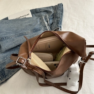 Brown leather large tote bag with spacious interior for school and daily fashion use