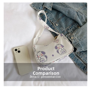 Close-up of white hobo bag with purple cartoon dog print and heart LUCK design