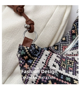 Close-up of geometric woven pattern and brown leather strap with silver metal ring