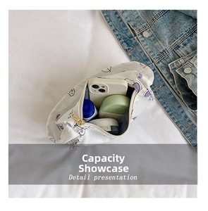 Detail presentation of white cartoon canvas bag showing spacious interior capacity