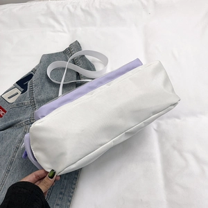 Sac messager minimaliste en toile violette et blanche avec bandoulière réglable