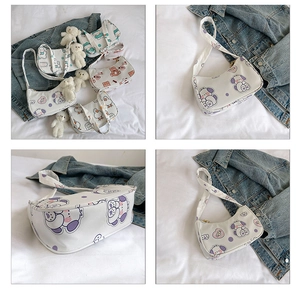 Detail shot of canvas underarm bags with cute cartoon prints like ducks and bears