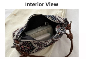 Interior view showing the large capacity and zipper closure of the ethnic woven bag