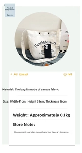 Detail view of large white canvas tote bag showing dimensions 41cm x 31cm with letter print