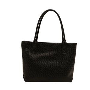 Minimalist black woven tote bag with spacious design and long shoulder straps for daily use