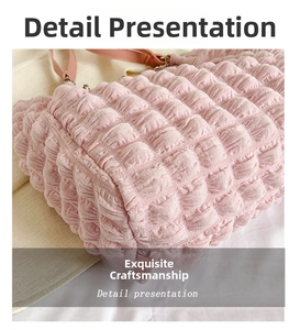 Detail presentation of pink bubble fabric texture on a stylish women's shoulder bag