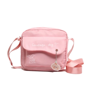 Cute pink canvas crossbody bag with white sausage dog print and adjustable strap