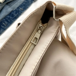 Japanese style canvas messenger bag with durable nylon straps and high-quality metal zippers
