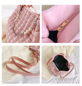 Detailed views of pink ruched bubble bag showing pearl chain, zipper, and interior lining