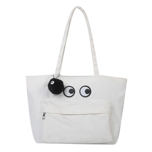Large white canvas tote bag with playful eye patches and a black soot sprite charm