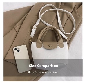 Mini tote bag in white and khaki leather shown next to a phone for size reference