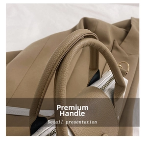 Close-up of litchi texture PU leather bucket bag with gold zipper and D-ring