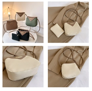 Detail of lychee pattern leather and gold metal buckle on a small crossbody bucket bag