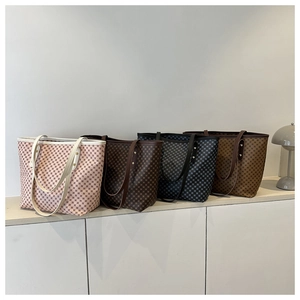Detailed row of large capacity tote bags in four colors with classic checkered print