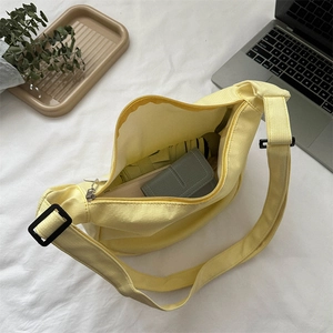 Top view of bright yellow canvas tote bag showing spacious interior and adjustable strap