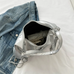 Silver metallic leather tote bag with chain strap showing large interior capacity