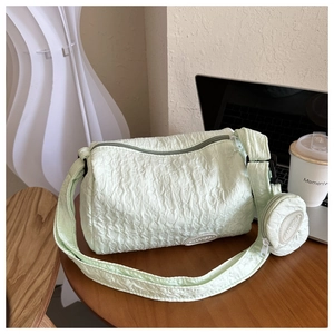 Detail of mint green nylon dumpling bag with a small matching round coin purse