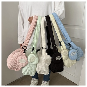 Selection of pleated nylon dumpling bags in pastel colors with mini round coin purses