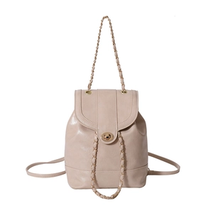 Mini cream leather chain backpack for women featuring flap closure and gold metal handle
