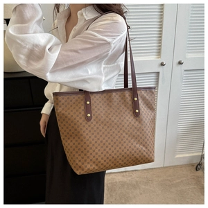 Brown vintage monogram tote bag shown on model for daily casual style and large capacity