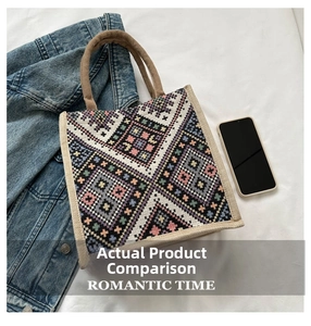 Close-up of geometric woven tote bag with colorful ethnic cross-stitch patterns