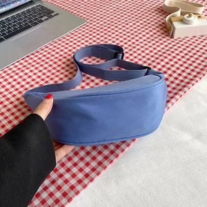 Light blue nylon crescent crossbody bag with adjustable strap for daily casual wear