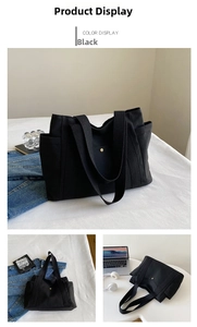 Detail view of large black canvas tote bag with metal buckles and side storage pockets