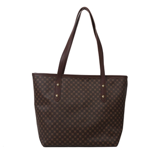 Deep brown tote bag with geometric print, leather straps and gold metal rivets on white background