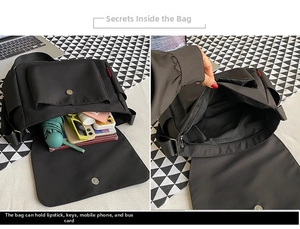 Detail of black nylon messenger bag interior showing main compartment and front pocket