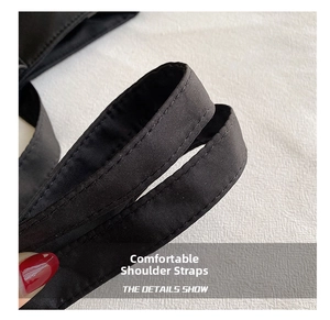 Close-up of durable black canvas tote bag shoulder strap with reinforced double stitching