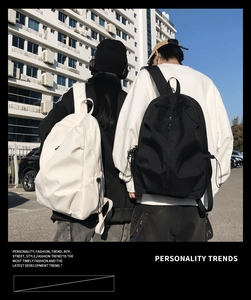 Rear view of stylish large capacity backpacks with side drawstring pockets and padded straps